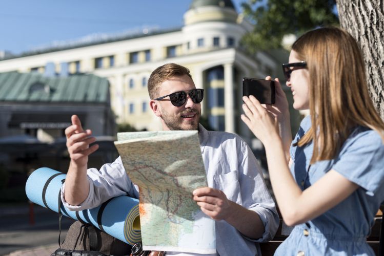 1772621433_coupleoutdoorswithbackpackmapjpg.jpg