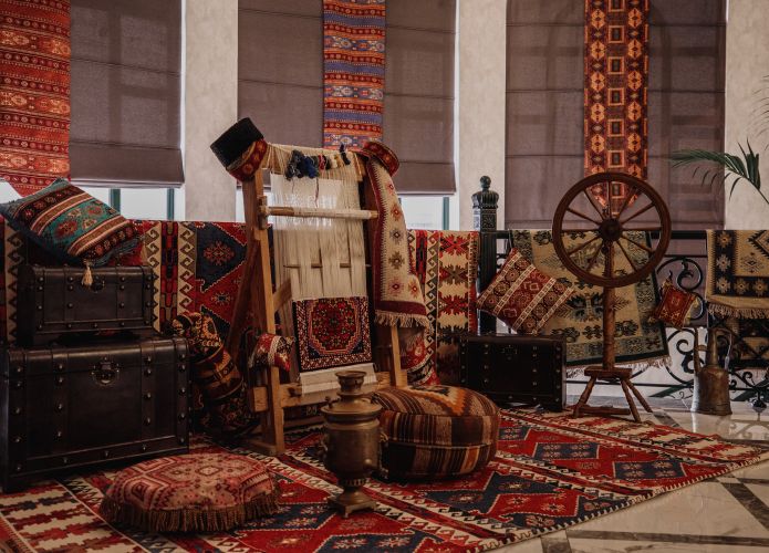1743445791_sideviewtraditionalrugbeingwovencarpetverticalloomorientalwalljpg.jpg